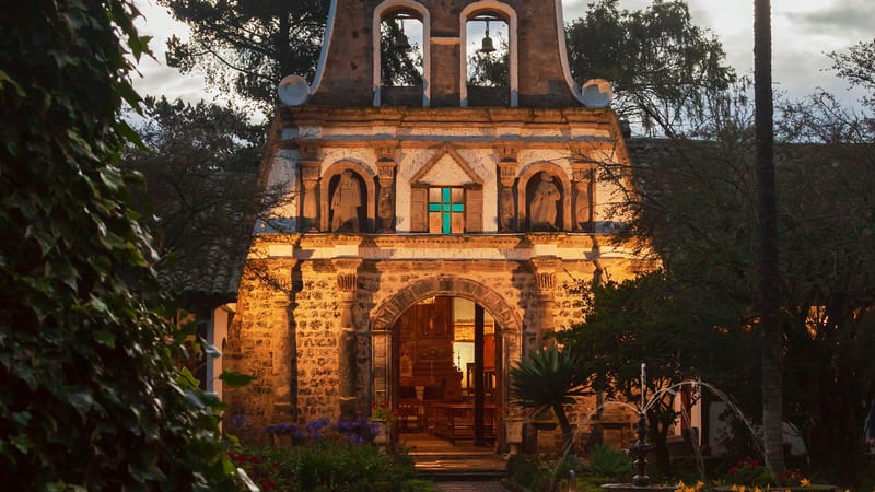 The chapel, lit for the evening — Hacienda La Ciénega, Cotopaxi — photograph by the hacienda
