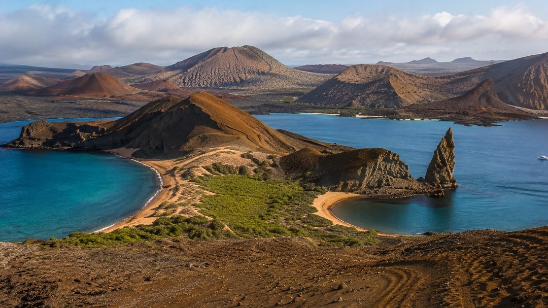 Pinnacle Rock and the twin crescent bays of Bartolomé, seen from the summit