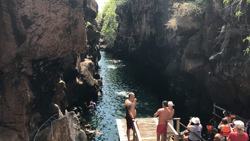The fissure itself, and the queue for the ladder — it is a popular swim, not a secret one — Las Grietas, Santa Cruz · January 2019